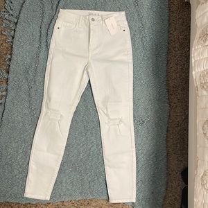 Whit high rise skinny jeans. Size 5